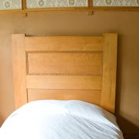 Frank Lloyd Wright Home and Studio - Interior: Master bedroom, headboard