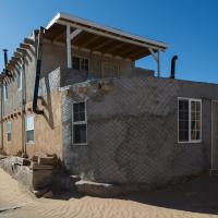 Acoma Pueblo  - Exterior: Two-Story House with Design on Facade 