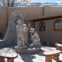 Santuario de Chimayo  - Exterior: Statue of Native American and Settlers 