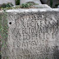 Inscription and Column Shafts - Exterior: View of an inscription and column shafts near the Basilica Aemilia