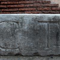 Colosseum - Detail: Sculptural fragment with inscription on display