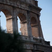 Colosseum - Exterior: View from ground of west Corinthian story columns and arches