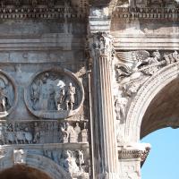 Arch of Constantine - Detail: View of Hadrianic Tondi on the South Face of the Arch depicting the Sacrifice of Silvano and Leaving for the Hunt with the Siege of Verona on the frieze below and a Victory in a Spandrel
