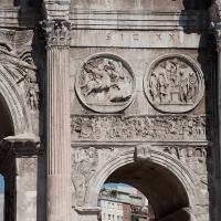 Arch of Constantine - View of Hadrianic Tondi on the South Face of the Arch depicting the Bear Hunt and the Sacrifice to Diana with the Battle of the Milvian Bridge on the frieze below and River Gods in the Spandrels