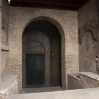 Santa Prassede - View of a brick passage with marble fragments near Santa Prassede
