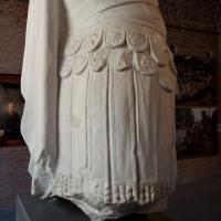 Headless Statue of a Man Wearing Body Armor - View of Statue Installation