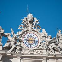 Saint Peter's Basilica - Exterior: View of Saints and Clock on Saint Peter's Square