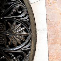 Saint Peter's Basilica - Interior: Detail View of Marble Flooring in Saint Peter's Basilica with a Metal Grate