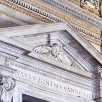 Saint Peter's Basilica - Exterior: View of the Pediment Over The Central Door in the Portico of Saint Peter's Basilica 