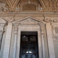 Saint Peter's Basilica - Exterior: View of a Door in the Portico of Saint Peter's Basilica looking towards Saint Alexander I and Saint Evaristus I