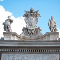Saint Peter's Square - Exterior: Saints Theobald, Theodore (by Lazzaro Morelli), Jerome, and Hilarion flanking Alexander VII's Coat of Arms of on the South Colonnade of St. Peter's Square