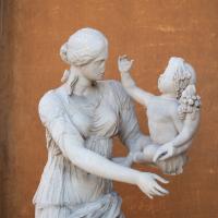 Female Statue with Child - View of a Female Statue holding a Child in the Cortile Della Pigna in the Vatican Museum