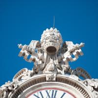 Saint Peter's Square - Exterior: View of a clock with sculpted figures in Saint Peter's Square