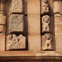 Brihadesvara Temple - Exterior: detail, mandapa south wall, between niche figures of isnu and Ganesha