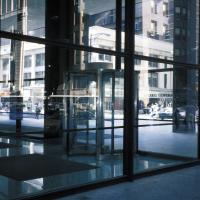 Loop Post Office, Chicago Federal Center - Exterior: Building Corner with view of exterior and interior through glass