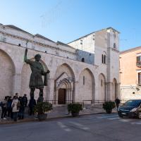Basilica Collegiata del Santo Sepolcro - Exterior: North Facade with Colosso di Barletta, Facing Southwest