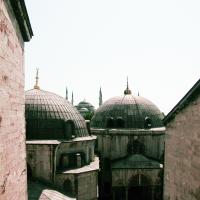 Hagia Sophia - Exterior: View Northeast from Southern Upper Level Gallery, Eastern Domes Blue Mosque in Background