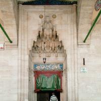 Sokullu Mehmed Pasha Camii - Exterior: Main Entrance Portal, Arcade, Muqarnas Ornamentation, Inscription