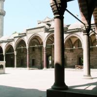 Suleymaniye Camii - Exterior: Mosque Complex Courtyard Facing Southeast; Main Entrance Portal to Right