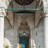 Sokullu Mehmed Pasha Camii - Exterior: Main Entrance Portal, Arcade, Muqarnas Ornamentation, Inscription, Domed Bay