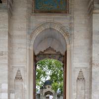 Suleymaniye Camii - Exterior: Entrance Portal Facing Northwest, Inscription, Blind Niches, View of Complex Entrance Gate