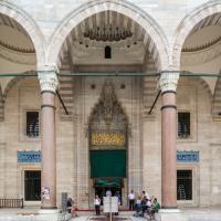 Suleymaniye Camii - Exterior: Mosque Main Entrance Portal; Inscription; Domed Bays; Covered Portico; Facing Southeast