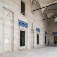 Suleymaniye Camii - Exterior: Looking South Along Mosque Entrance Facade; Iron-Grilled Windows; Inscriptions