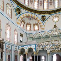 Beylerbeyi Camii - Interior: Central Prayer Hall, Facing West Corner Arcade, Light Fixture, Pendentives with Calligraphic Inscription