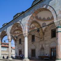 Cerrah Mehmed Pasha Camii - Exterior: Northwest Portico, Arcade, Facing East, Muqarnas Column Capitals, Ablaq Detail on Pointed Arches