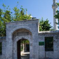 Cerrah Mehmed Pasha Camii - Exterior: Complex Entrance, Minaret, Quranic Inscription Above Spandrel