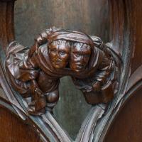  Cathedrale Notre-Dame - Two heads with one bonnet--one man holds open book